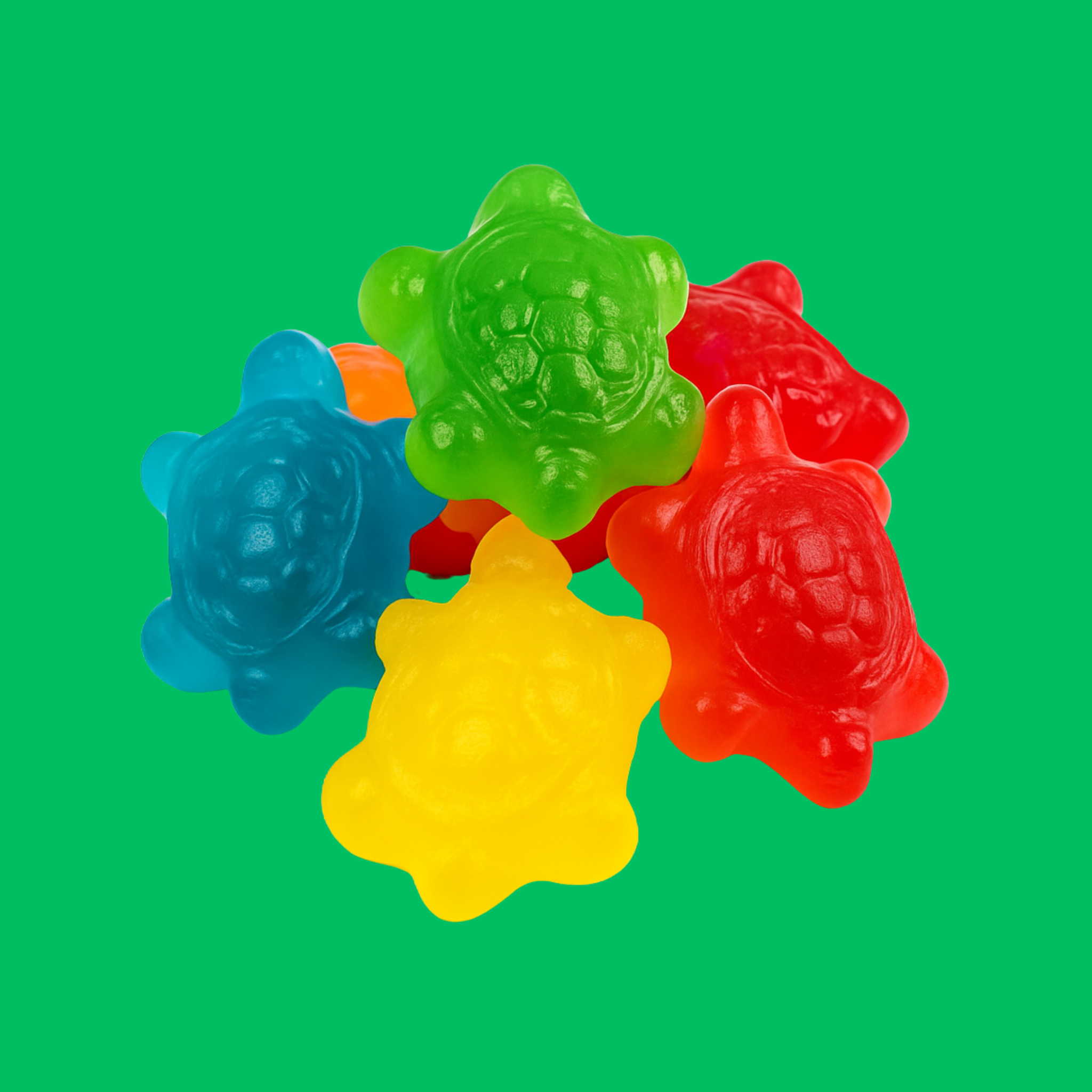 A pile of halal jelly turtles on a green background.
